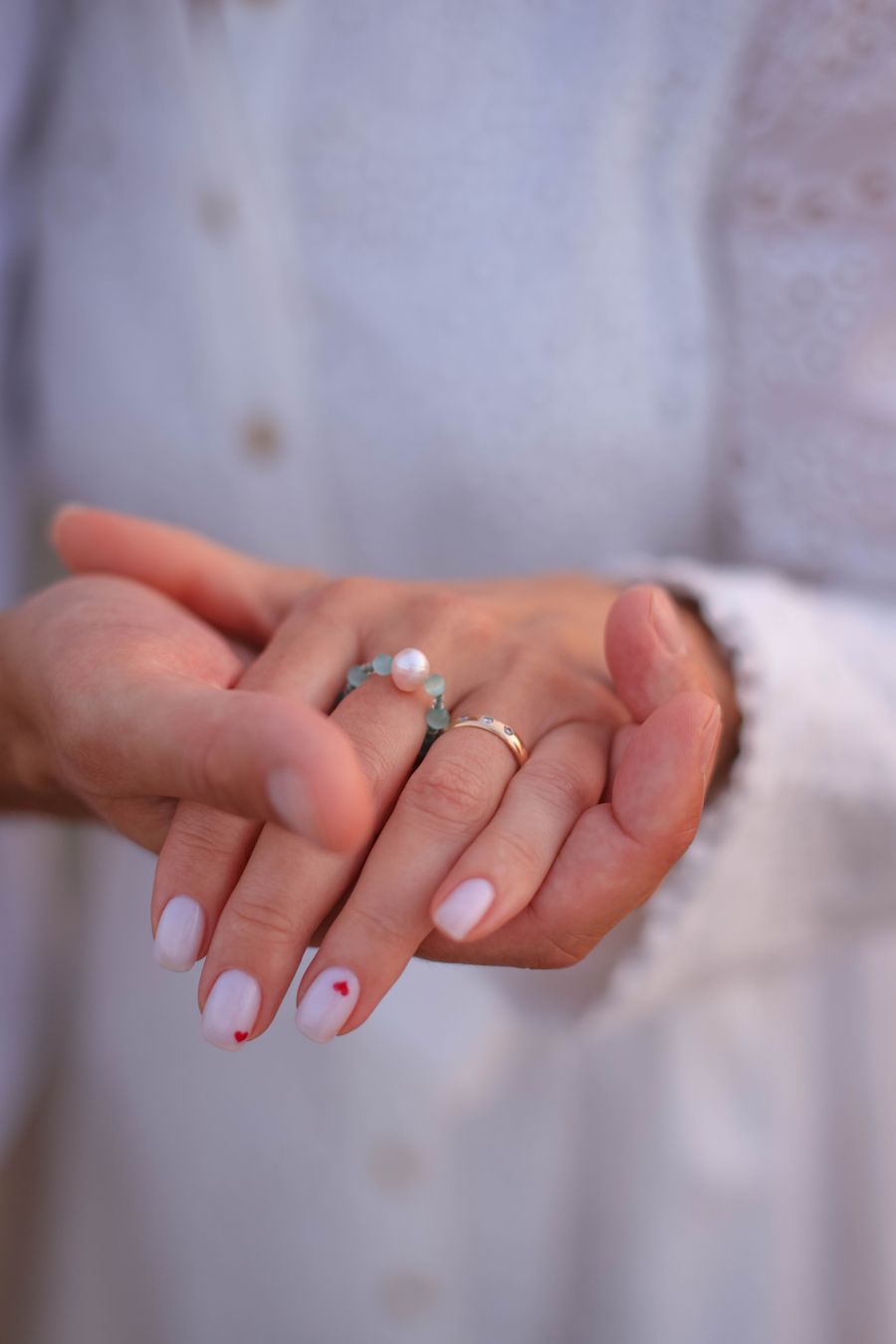 Milky nails with hand-painted hearts